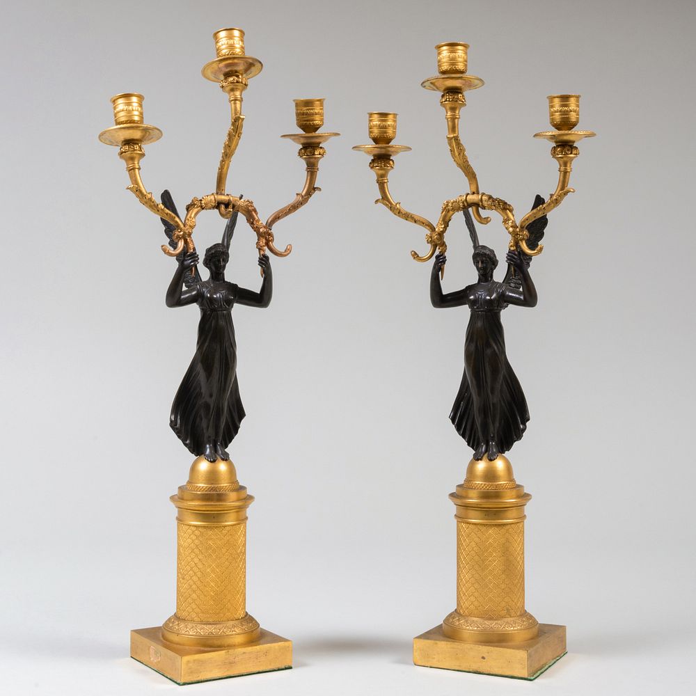 Appraisal: Pair of Empire Bronze and Parcel-Gilt Three-Light Figural Candelabra x