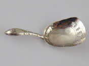 Appraisal: A Georgian silver caddy spoon the bowl engraved and with