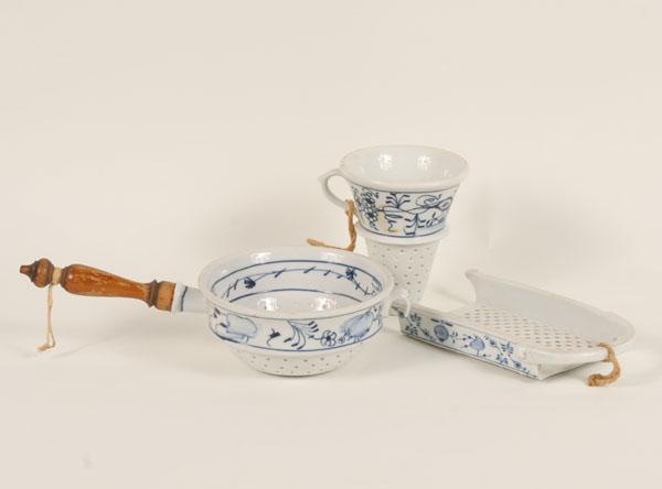 Appraisal: German porcelain grater and two strainers one with a pan