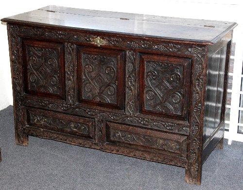 Appraisal: An th Century style oak mule chest with later carved