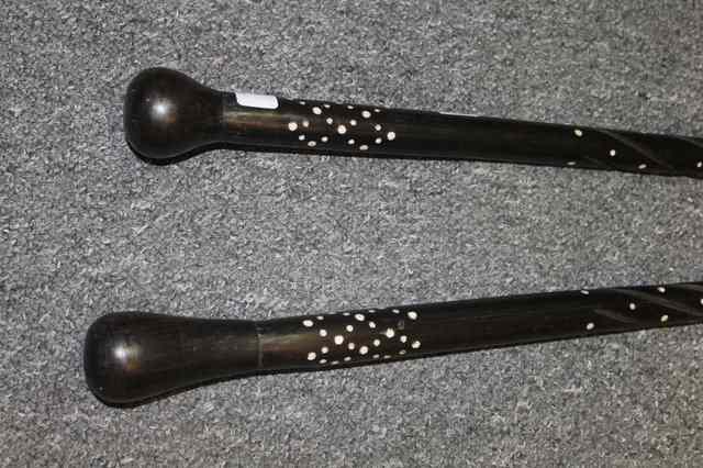 Appraisal: TWO AFRICAN HARDWOOD WALKING CANES with inlaid bone wood decoration