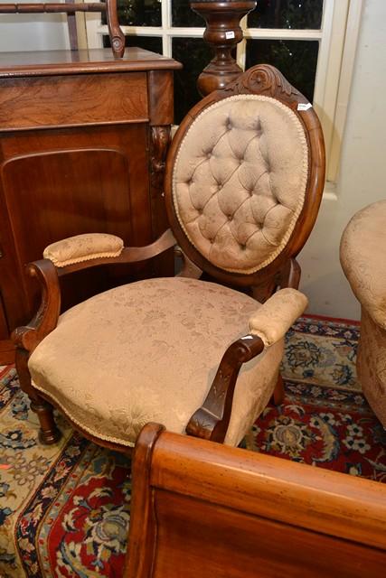 Appraisal: A VICTORIAN WALNUT GENT'S AND LADY'S CHAIRS