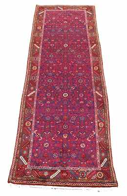 Appraisal: A Bijar Runner Reds on blue background overall floral pattern