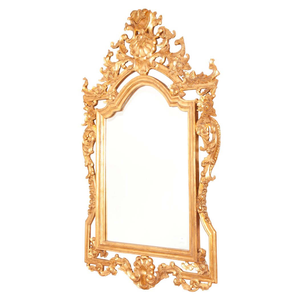 Appraisal: Louis XV Style Giltwood Mirror Modern The arched mirror plate