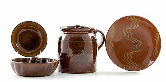 Appraisal: Redware tablewares probably Pennsylvania th century comprising yellow slip-decorated coggled