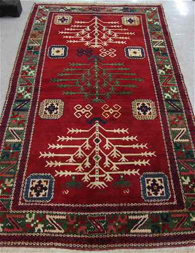 Appraisal: HAND KNOTTED ORIENTAL AREA RUG geometric and stylized curvilinear decoration