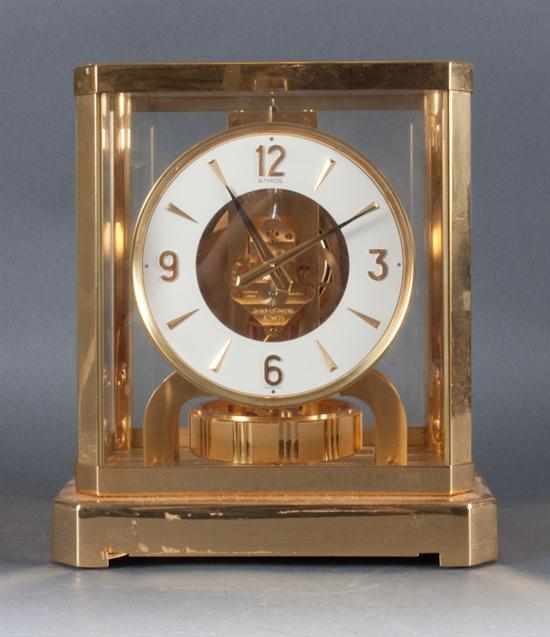 Appraisal: Jaeger Le Coulture brass Atmos clock th century brass works