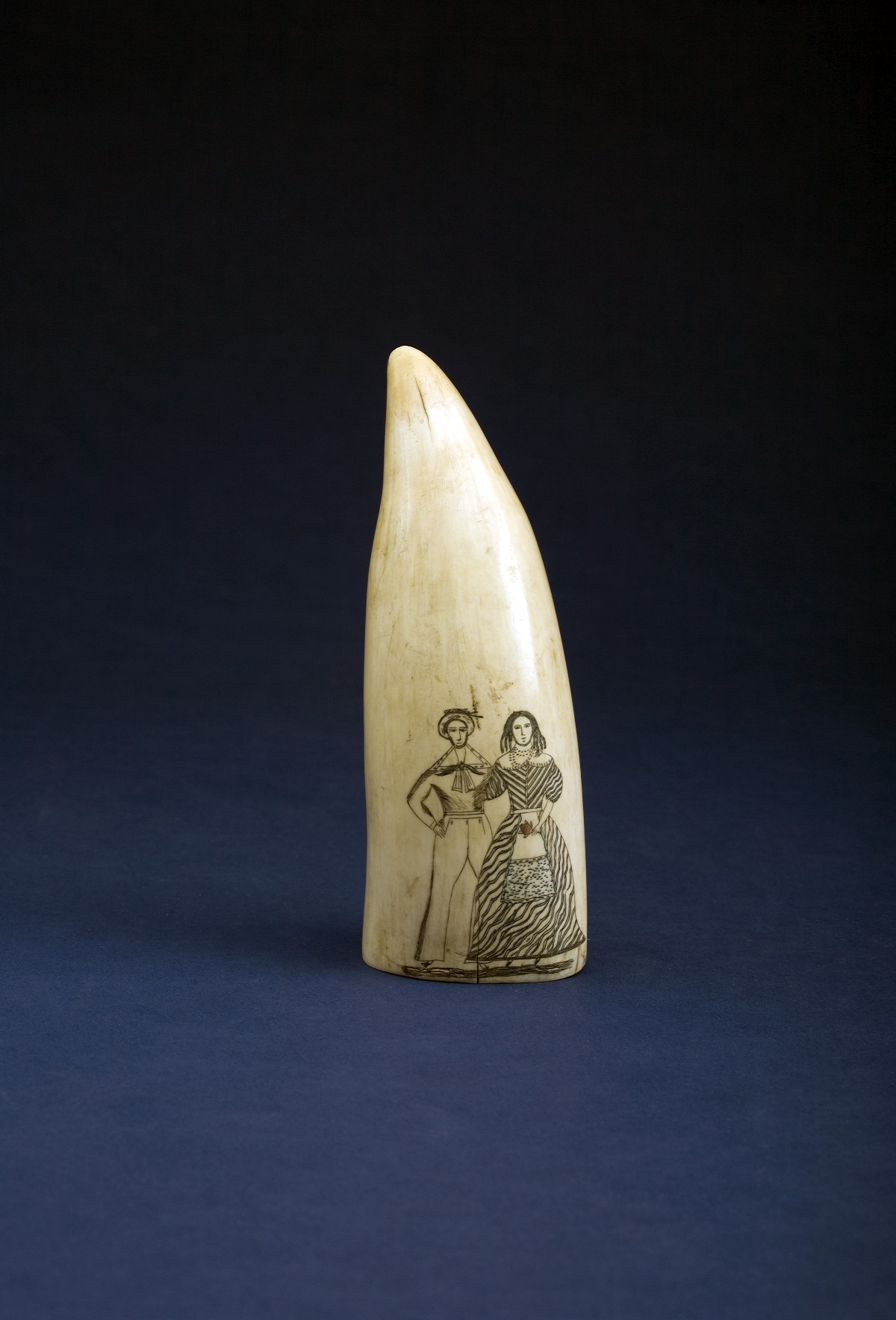 Appraisal: SCRIMSHAW POLYCHROMED WHALE'S TOOTH NINETEENTH CENTURY Possibly depicting a wedding