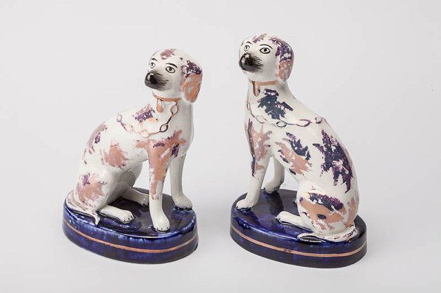 Appraisal: A PAIR OF ANTIQUE CERAMIC DOUBLE LUSTRE GLAZED SPOTTED SEATED