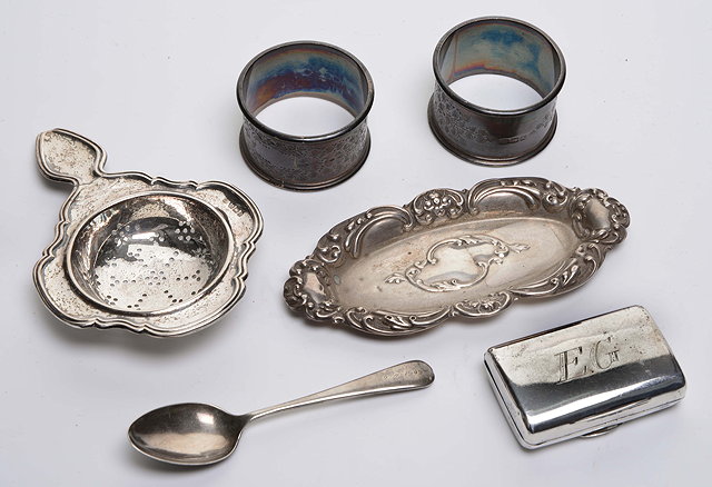 Appraisal: A PAIR OF SILVER FLOWER DECORATED NAPKIN RINGS together with