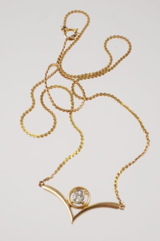 Appraisal: K yellow gold necklace with diamond chevron or V pendant