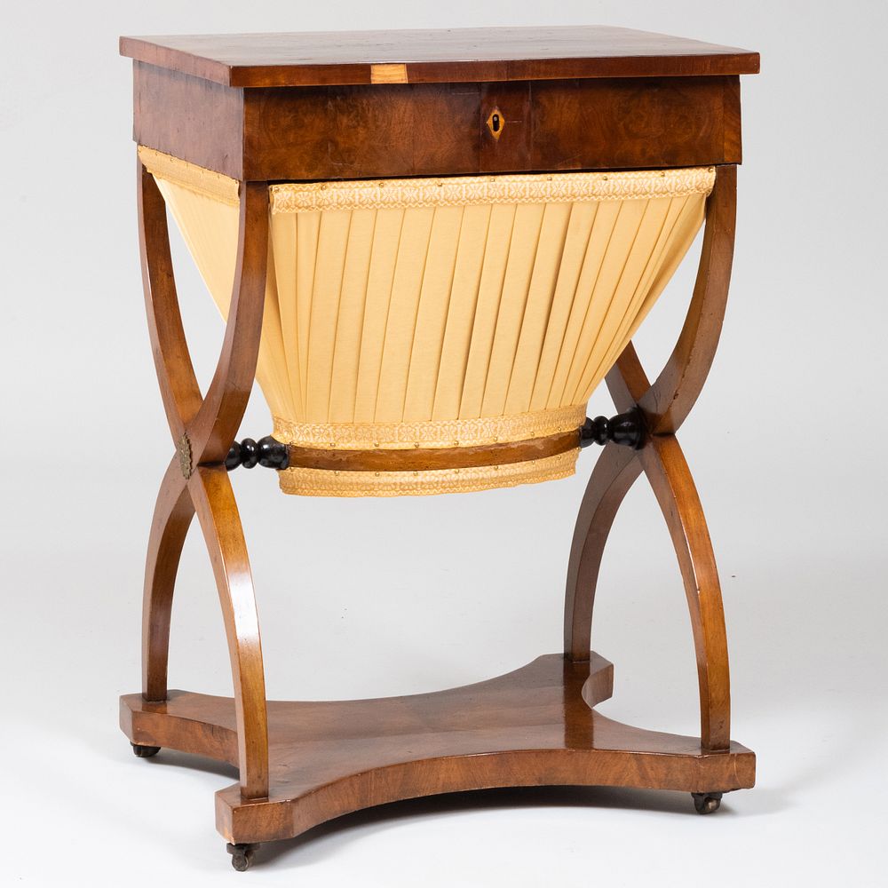 Appraisal: Late Biedermeier Walnut Sewing Table The hinged top opening to