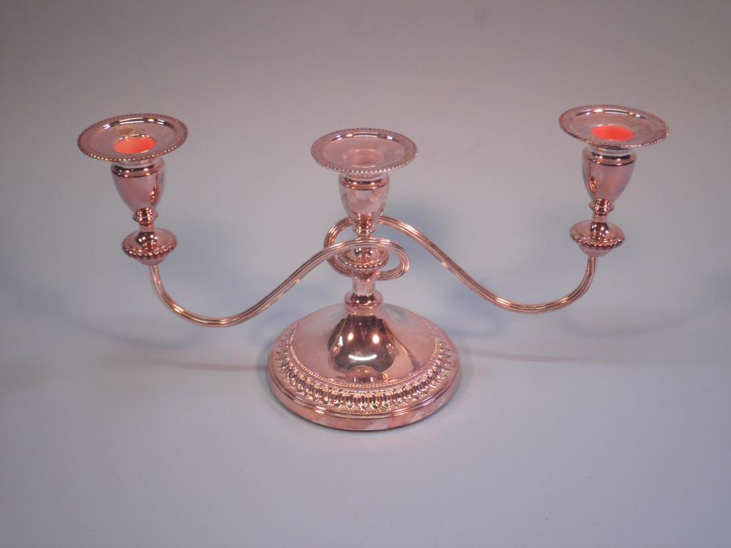 Appraisal: A Viners silver plated three branch candelabra with leaf moulded