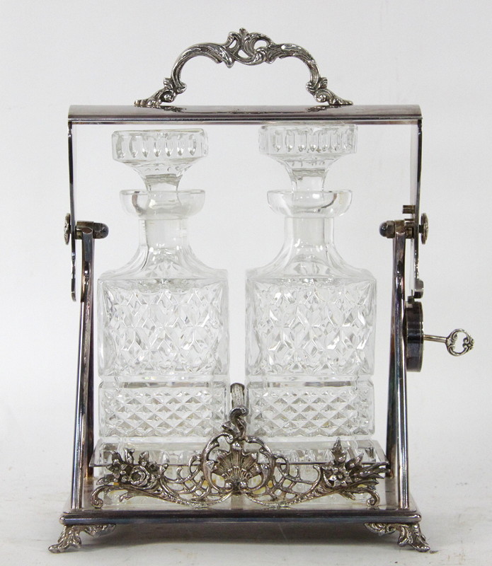 Appraisal: A silver plate tantalus fitted with two bottles and stoppers