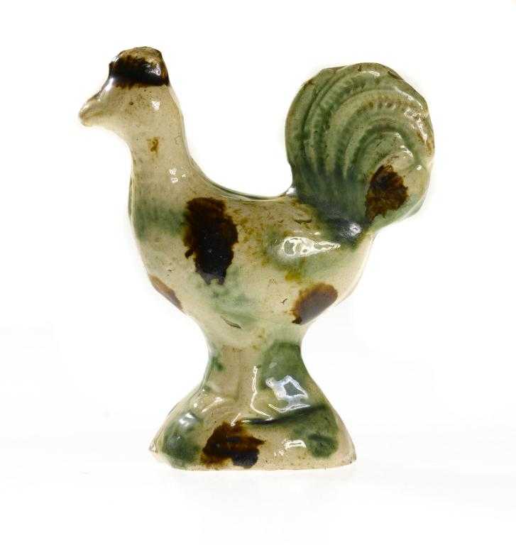 Appraisal: A STAFFORDSHIRE EARTHENWARE MODEL OF A COCKEREL decorated with brown