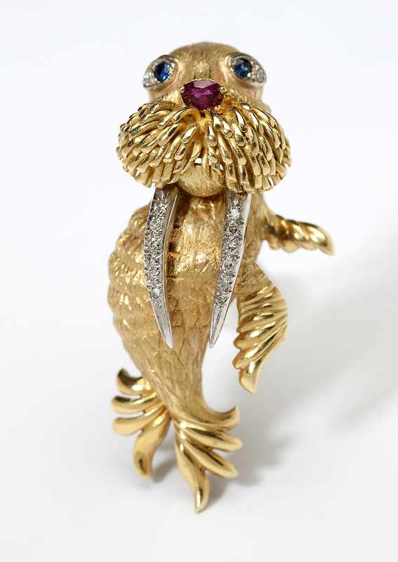 Appraisal: A gem-set gold walrus brooch Stamped K gold with illegible