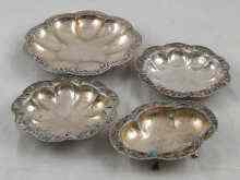 Appraisal: A suite of four Oriental white metal tests silver and