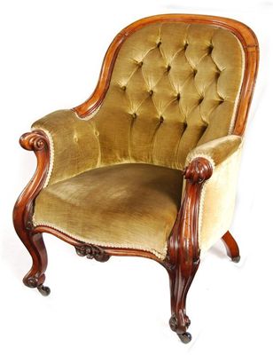 Appraisal: An Irish Victorian mahogany easy armchair the button upholstered back