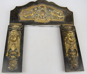 Appraisal: A slate three-piece miniature fire surround with ornate brass mounts