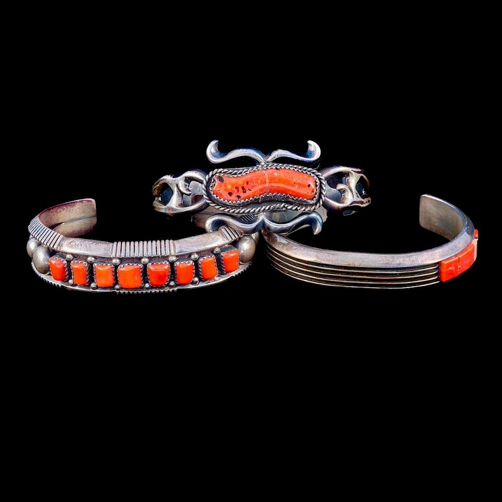 Appraisal: NAVAJO CUFF BRACELETS Three old pawn coral and silver cuff