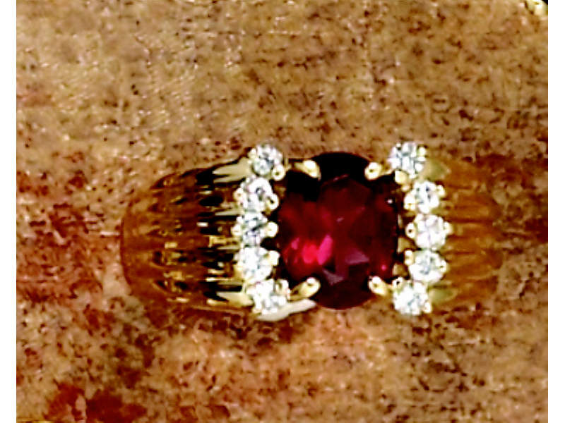 Appraisal: GARNET AND DIAMOND RING k yellow gold lady's ring set