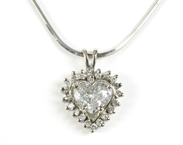 Appraisal: DIAMOND PENDANT NECKLACE WITH APPRAISAL The heart shaped pendant is