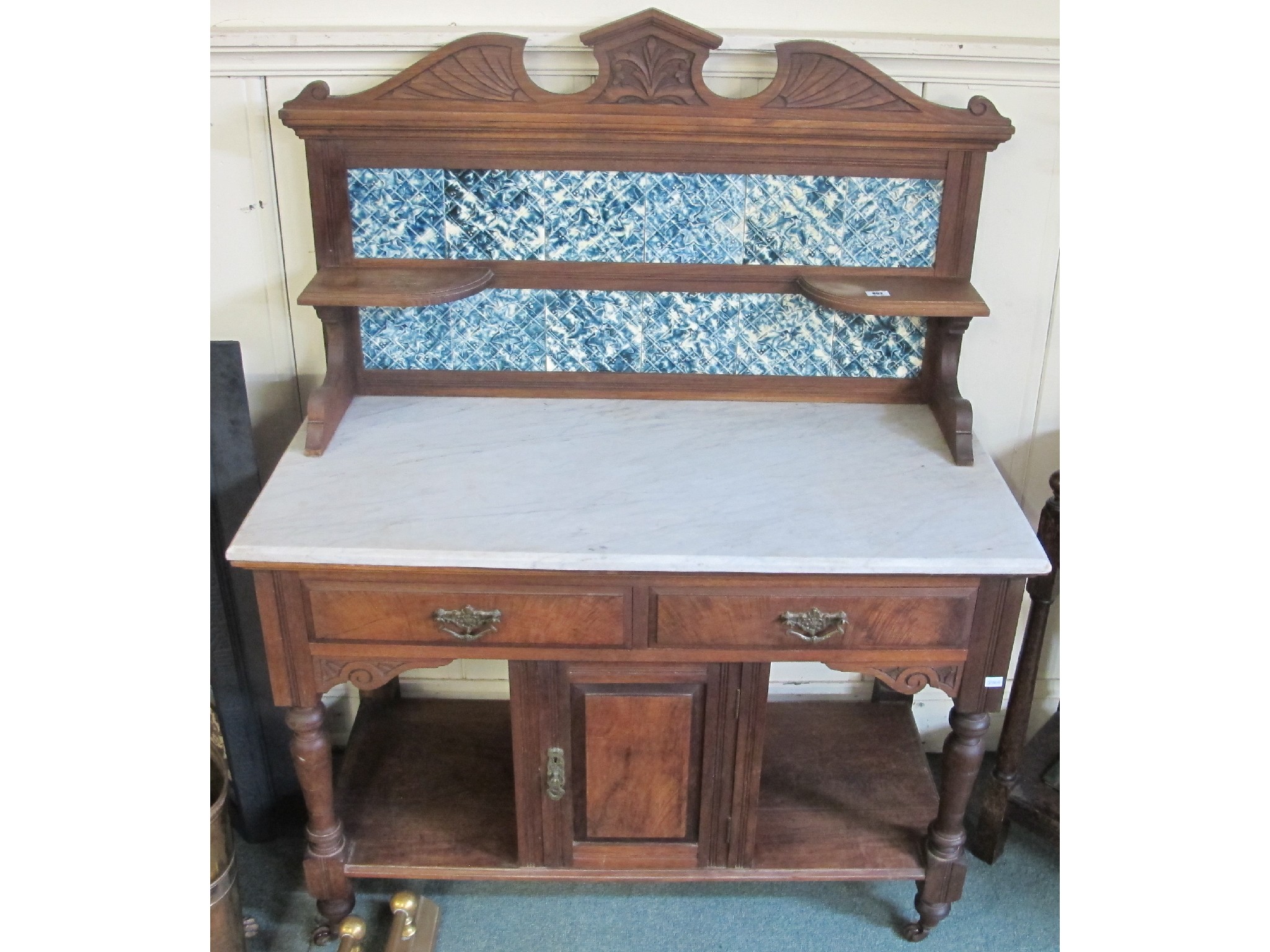 Appraisal: A Victorian washstand marble topped with tiled back