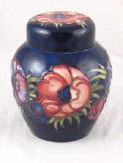 Appraisal: A Moorcroft ginger jar in the anemone pattern on deep