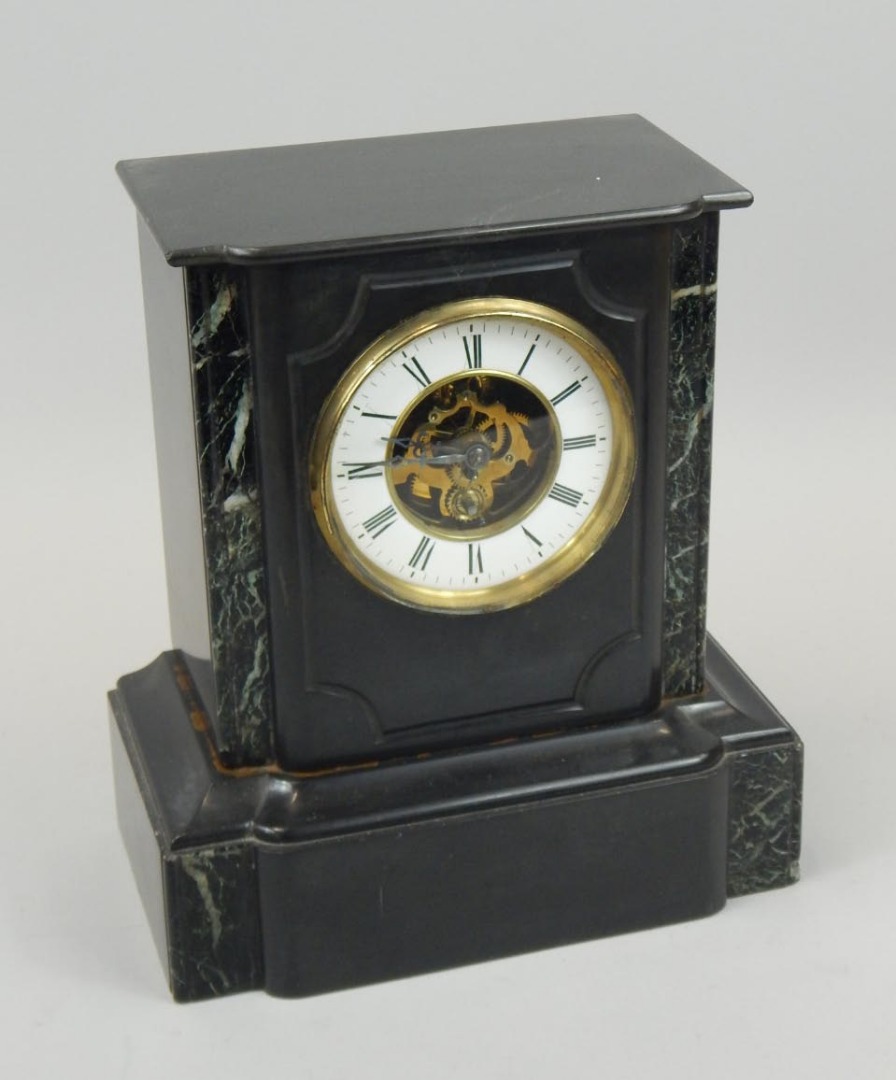 Appraisal: A late thC French black slate and marble mantel timepiece