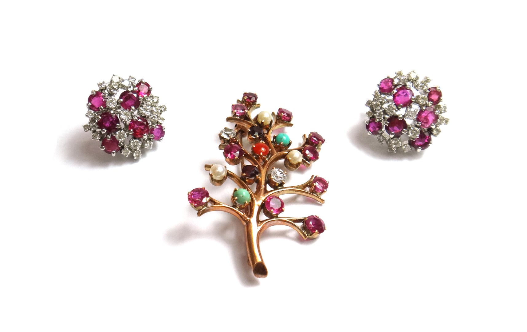 Appraisal: A pair of white gold ruby and diamond set cluster