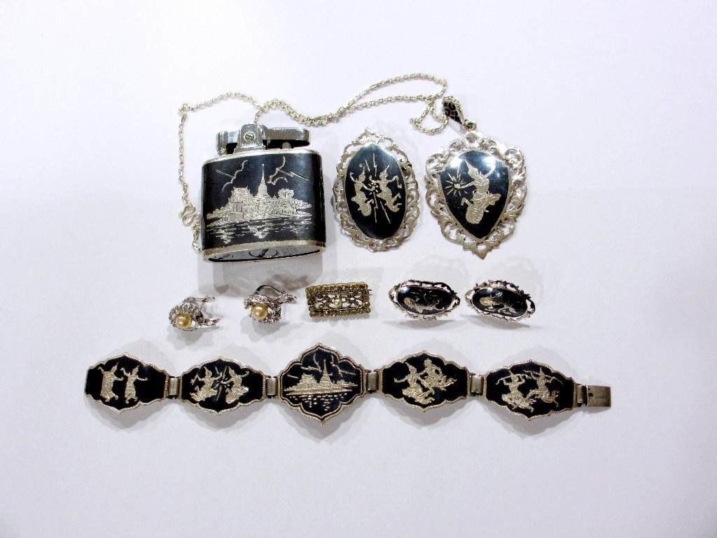 Appraisal: A collection of Siamese silver and niello jewellery decorated with