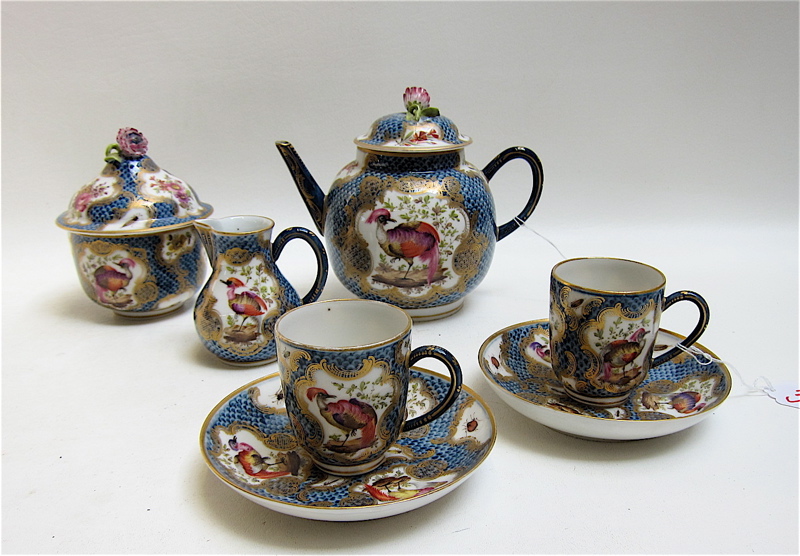 Appraisal: SEVEN PIECE CERAMIC TEA SET ornately decorated with hand painted