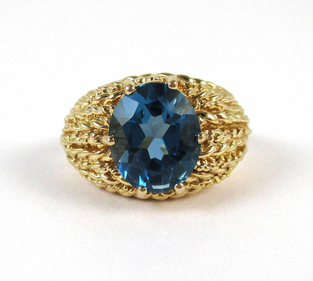 Appraisal: BLUE TOPAZ AND FOURTEEN KARAT GOLD RING with six yellow