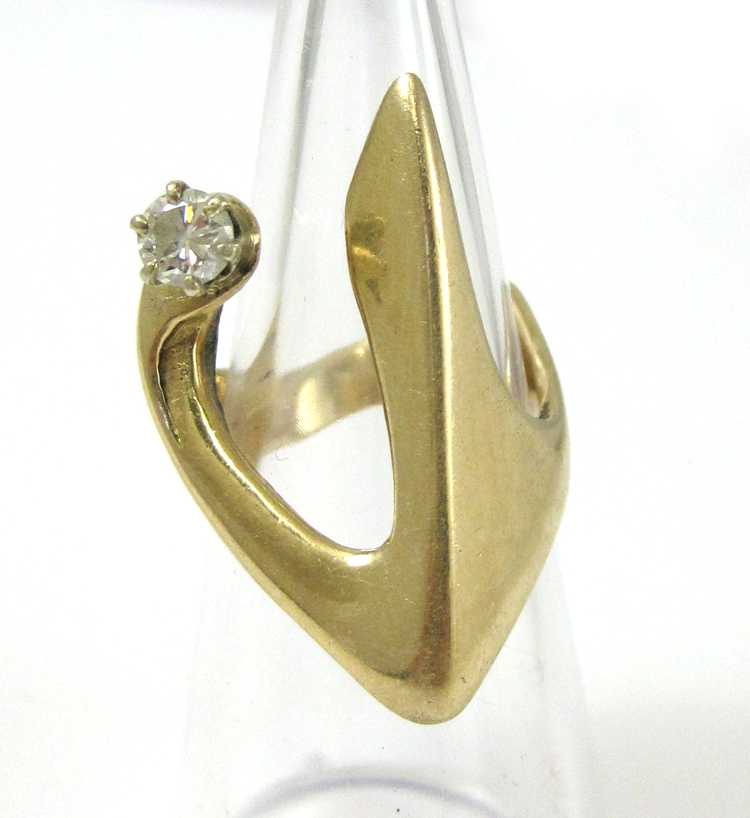 Appraisal: DIAMOND AND FOURTEEN KARAT GOLD RING set with a single