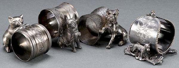 Appraisal: VICTORIAN SILVERPLATE FIGURAL NAPKIN RINGS A GROUP OF THREE VICTORIAN