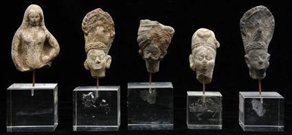 Appraisal: Group of Nine Terracotta Indian Heads