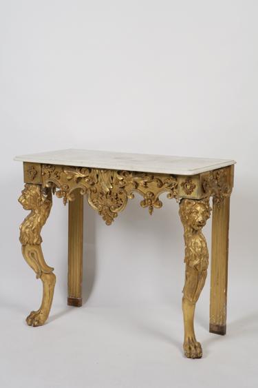 Appraisal: A REGENCY GILTWOOD CONSOLE TABLE with a white marble top