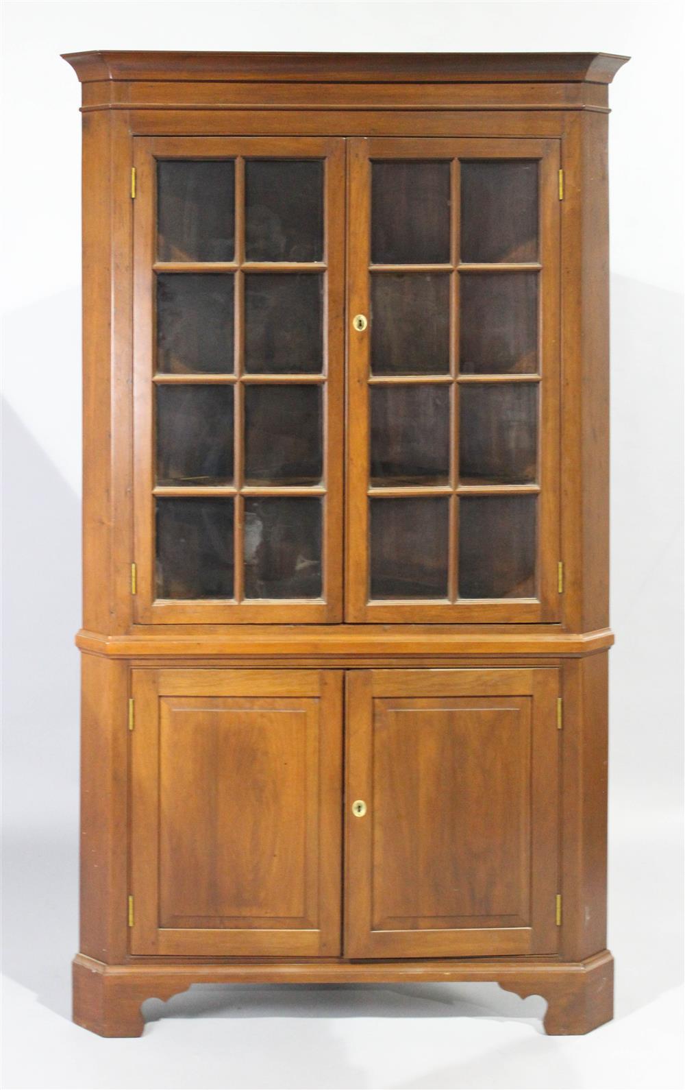 Appraisal: CHIPPENDALE STYLE WALNUT CORNER CUPBOARD having a shaped molded straight