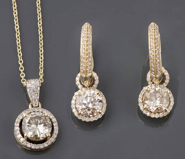 Appraisal: A pair of diamond and k gold day-night earrings with