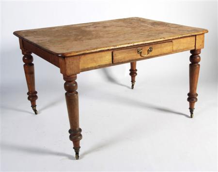 Appraisal: A Victorian pine kitchen table the rounded rectangular top over