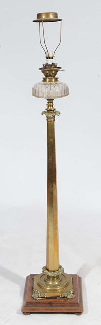 Appraisal: A VICTORIAN BRASS FLOOR STANDING OIL LAMP with circular glass