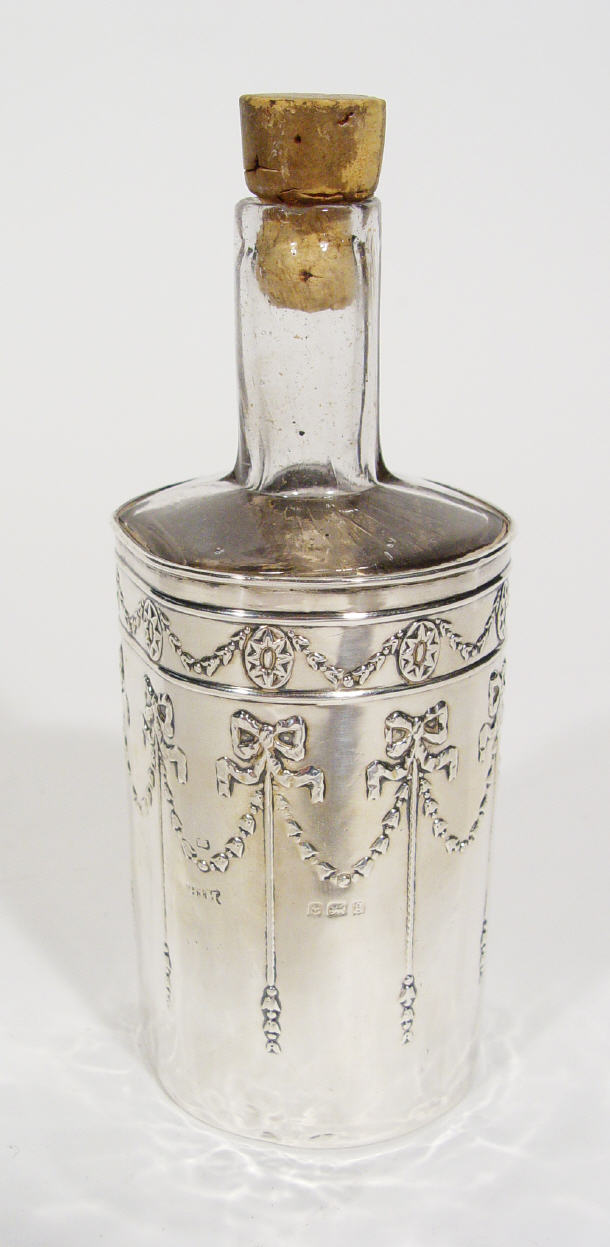 Appraisal: Clear glass bitter bottle in a swag and bow embossed