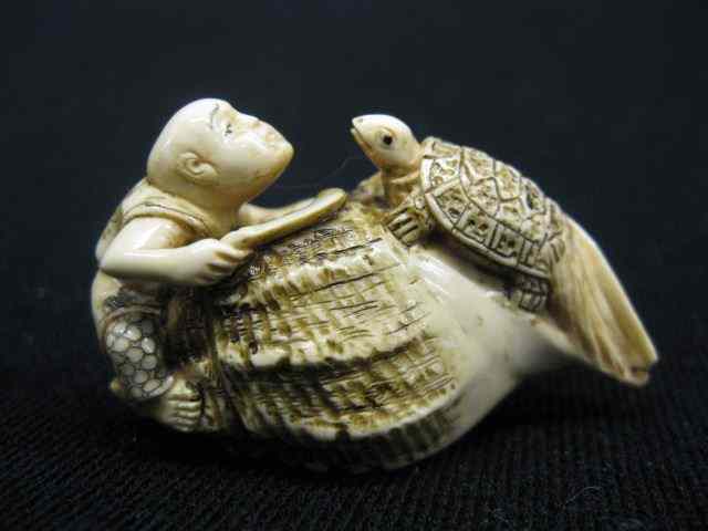 Appraisal: Carved Ivory Netsuke of Man Turtleclimbing on a giant shell