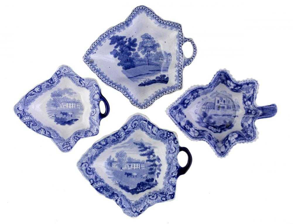 Appraisal: FOUR BLUE PRINTED EARTHENWARE PICKLE DISHES of vine leaf shape