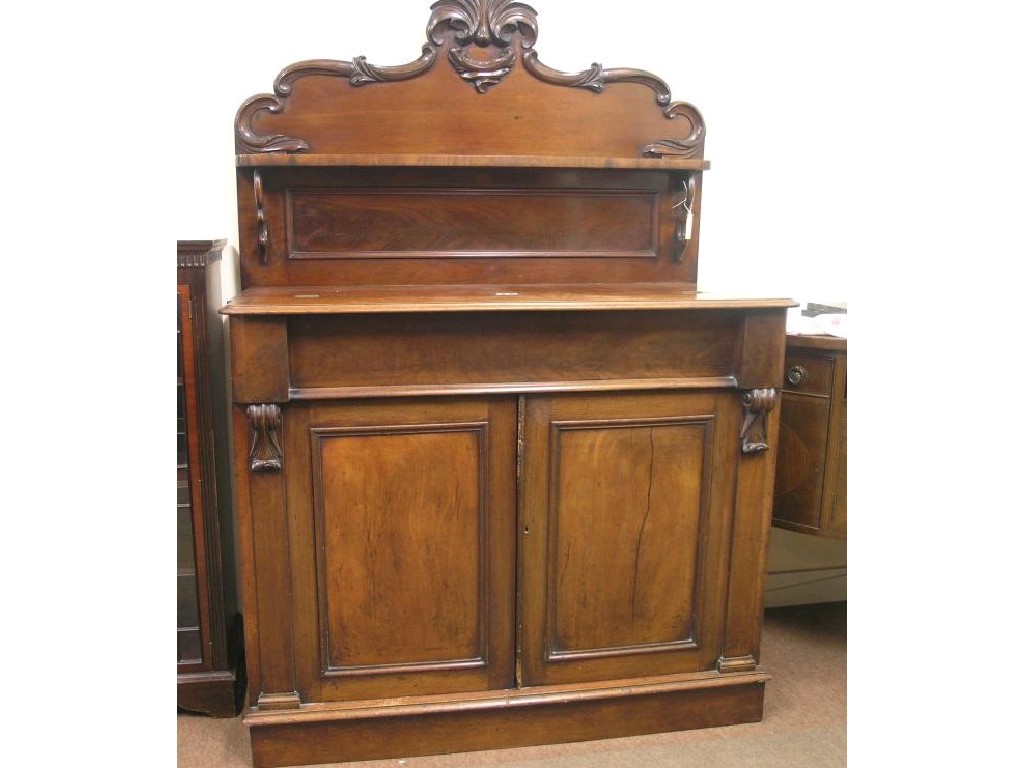 Appraisal: An early Victorian mahogany chiffonier modified raised back with over-shelf