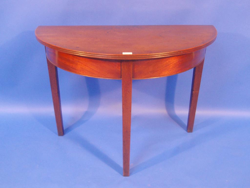 Appraisal: A thC mahogany demi-lune table with reeded top and square