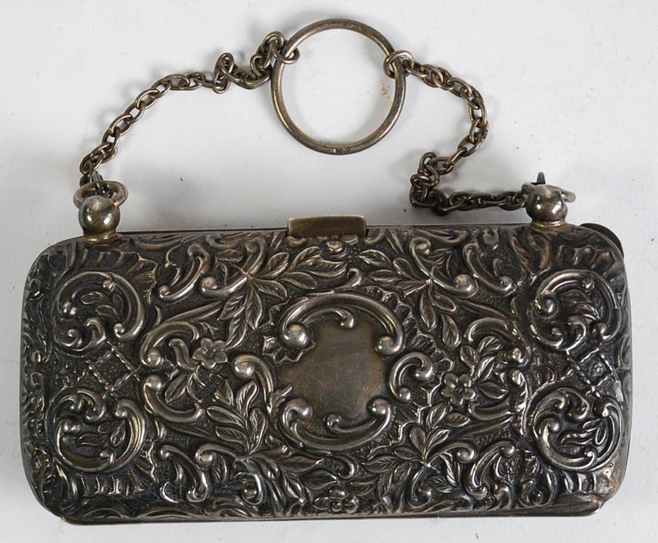 Appraisal: EDWARDIAN SILVER OBLONG PURSE repousse with flowers foliage and 'C'