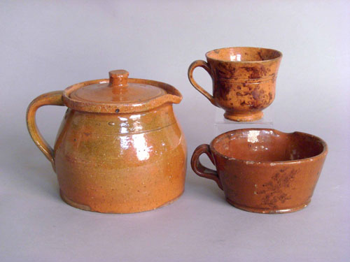 Appraisal: Four redware mugs th c h h h and h