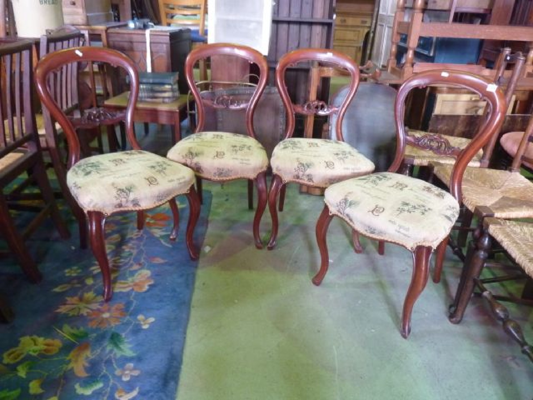 Appraisal: A set of four Victorian mahogany balloonback dining chairs with