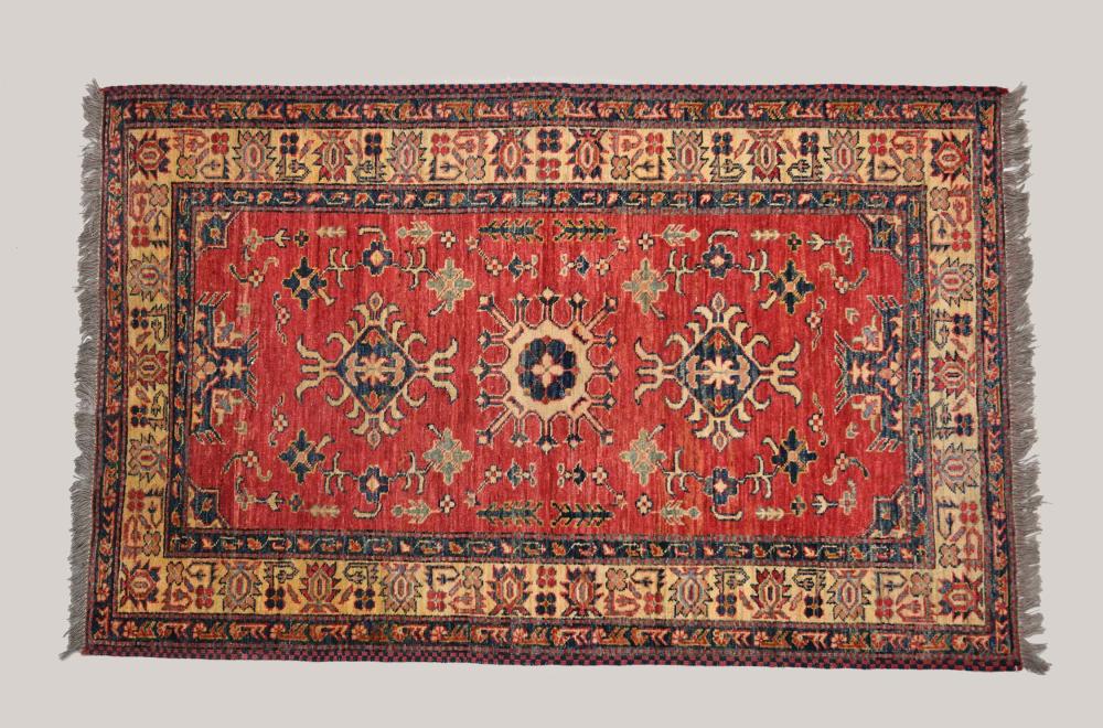 Appraisal: TURKISH WOOL RUGThree small medallions on a red field with